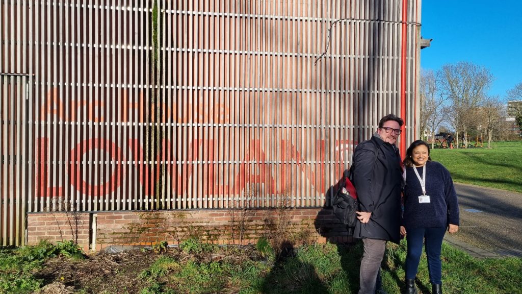 Cllr Stephen Hickman and Cllr Aneka Shah-Levy standing outside Nomad Centre on Lowlands Rec