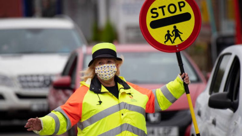 CARDIFF, WALES - SEPTEMBER 11: A crossing attendant wears a face covering while at work on September 11, 2020 in Cardiff, Wales. In a tightening of lockdown rules intended to curb a rise in coronavirus cases the First Minister of Wales Mark Drakeford has announced people in Wales must wear face mask in shops and other indoor public spaces from Monday. Indoor meetings of more than six from an extended household will be illegal from Monday. The rule will not apply to children under 11 and up to 30 people from different homes can still meet outside. (Photo by Matthew Horwood/Getty Images)
